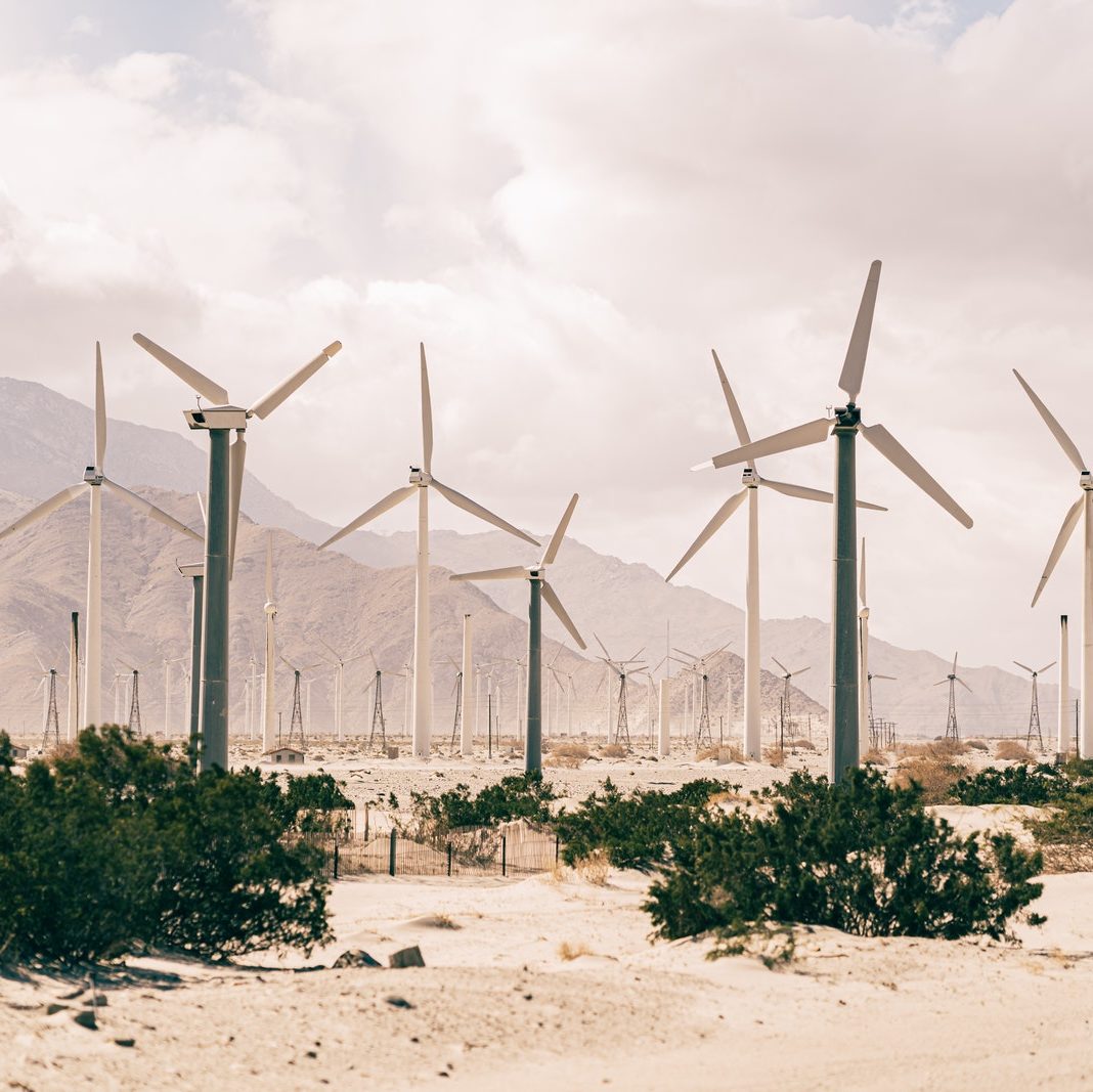 Wind Turbines On Brown Sand