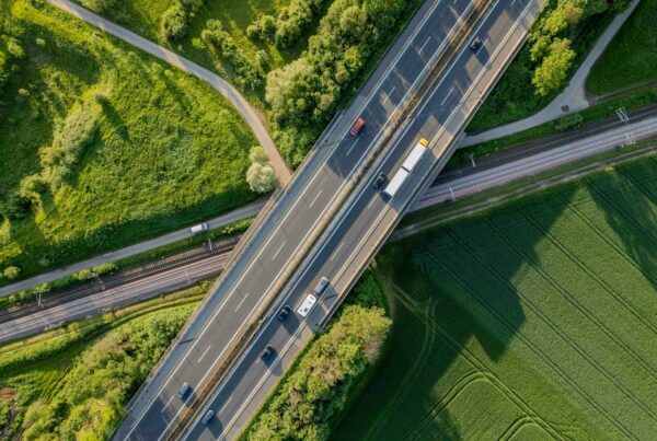 an aerial view of a highway with cars on it